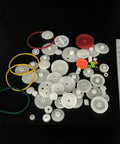 Assorted components from 60 Piece Plastic Gear Kit For DC Motors And RC Cars Belt Pulleys Spindle Gears Crown Gears Racks And More DIY Gear Replacement Set