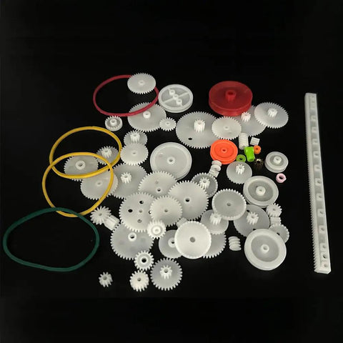 Assorted components from 60 Piece Plastic Gear Kit For DC Motors And RC Cars Belt Pulleys Spindle Gears Crown Gears Racks And More DIY Gear Replacement Set