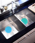 Slick Silicone Tub Stopper Two Pack, 5 Inch Flat Suction Bath Plug With Heavy Grip in stainless steel sink, blue design.