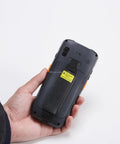 Hardcore Rugged PDA With Numeric Keypad And Swift 2D Scanner, Industrial Android 9 Handheld Computer shown from the back in hand.