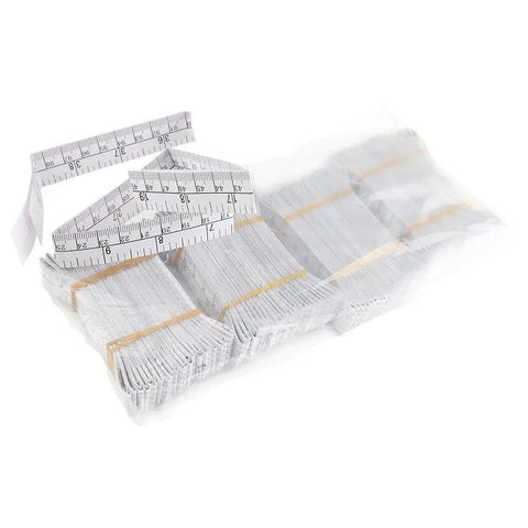 Disposable Paper Tape Measure for Medical Use 40 Inch by Three Quarter Inch Write On Tape for Recording Patient Info Baby Head Circumference Ruler Eco Friendly Coated Paper Pack of 100 showing multiple rolled tapes.