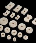 20 Piece Watch Case Press Die Kit With Nylon Fitting Dies For Table Model Capping Machine Includes Round Square And Shield Dies For Back Case Repair DIY Friendly White ABS Plastic. Variety of white ABS plastic dies for watch repairs on black background.