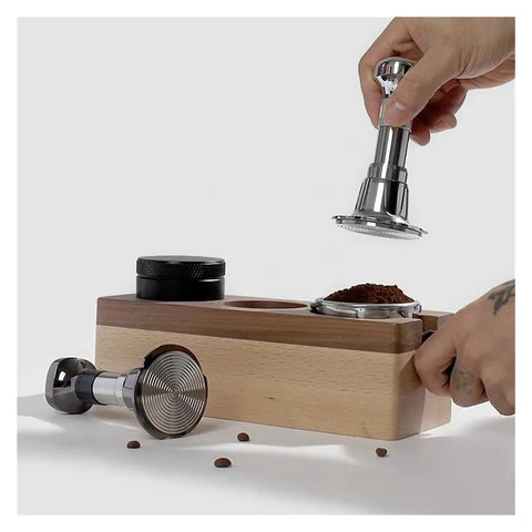Pro Grade Stainless Steel Espresso Tamper Kit With Auto Rebound For 51 53 And 58 Mm Portafilters in use on wooden base.