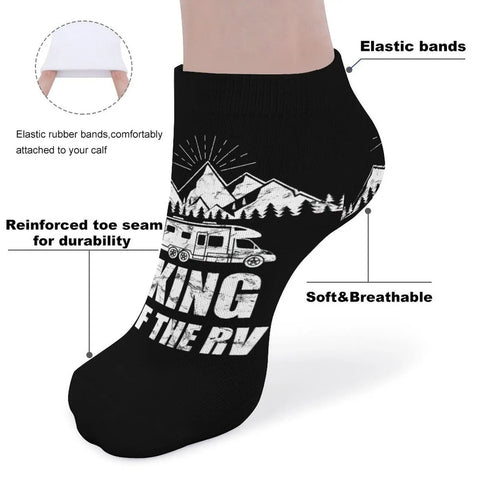 Black ankle sock with "King of the RV" print, showing elastic bands, reinforced toe seam, and breathable mesh for comfort.