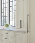 Oil Rubbed Bronze Bar Cabinet Pull 3 Inch Center To Center Contemporary Drawer Handle 5-3/8 Inch installed on kitchen cabinets