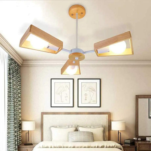 Slick Modern Metal 5 Light Pendant Chandelier Ceiling Lamp with wood accents in stylish bedroom setting.