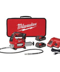 M18 2 Speed Cordless Grease Gun Kit with 2 compact batteries, charger, and carrying case, durable red finish, quick connect nozzle