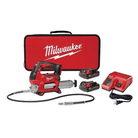 M18 2 Speed Cordless Grease Gun Kit with 2 compact batteries, charger, and carrying case, durable red finish, quick connect nozzle