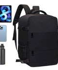 Carry On Friendly Hiking Backpack With Expandable Capacity Opens Flat For Easy Packing next to phone, tablet, and water bottle.