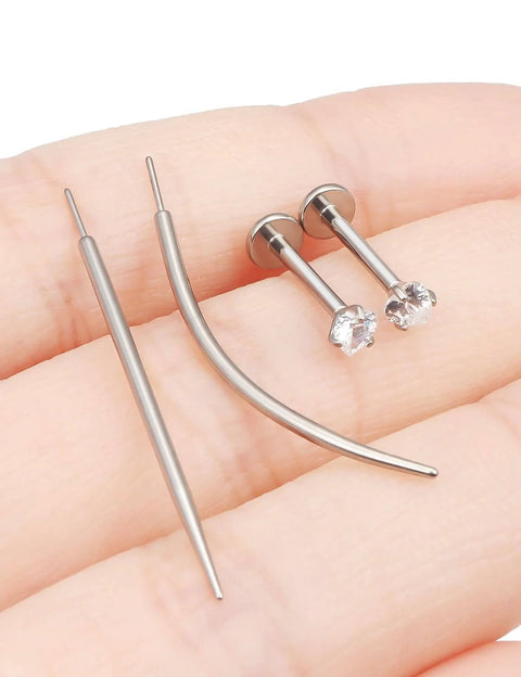 Titanium Threadless Medusa Piercing Jewelry Set 16G 10mm Flat Back Studs with taper tools and CZ stones on a hand