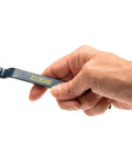 Hand holding a pry bar from 3 Piece Pry Bar Set With 5.5 Inch, 7.5 Inch And 10 Inch Nail Pullers, Wide Thin Blades, Forged Steel Construction