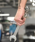 Close-up of hand holding wrench and silver Trailer Tailgate Lifting Assist Rollers Kit With Aluminum Alloy Rollers Pins And Washers