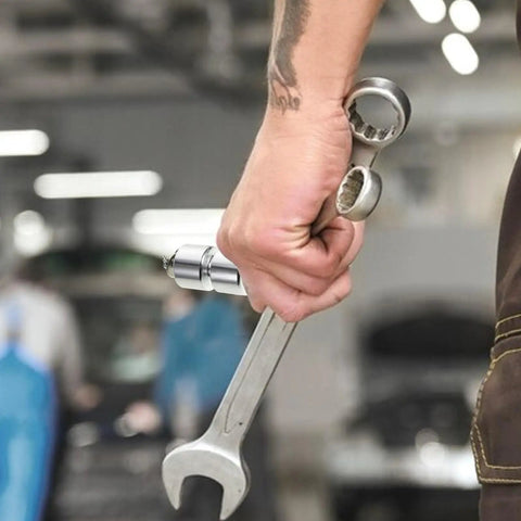 Close-up of hand holding wrench and silver Trailer Tailgate Lifting Assist Rollers Kit With Aluminum Alloy Rollers Pins And Washers