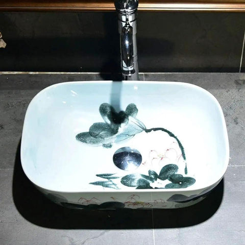 Rectangular Ceramic Vessel Sink For Bathroom Vanity Featuring A Super Sleek High Gloss Glaze That Stays Hella Tough And Keeps Your Space Looking Fresh All Year Round with floral design and central drain.