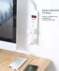 Power Strip Surge Protector With Six Outlets And A Two Foot Braided Fabric Extension Cord 300 Joules Wall Mounted Overload Protection Ideal For Home Or Office Durable Go To Tangle Free Design 2 Pack, mounted next to a monitor with connected devices