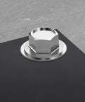 1/4 inch flat washer, 304 stainless steel, 5/8 in outer diameter, shown with hex nut on dark surface.