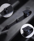 Heavy Duty Barn Door Hanger With Pointed Strap Rollers Rock Solid Metal Sliding Hardware close-up of matte black steel strap and rollers.
