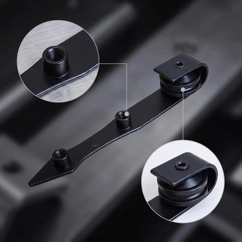 Heavy Duty Barn Door Hanger With Pointed Strap Rollers Rock Solid Metal Sliding Hardware close-up of matte black steel strap and rollers.