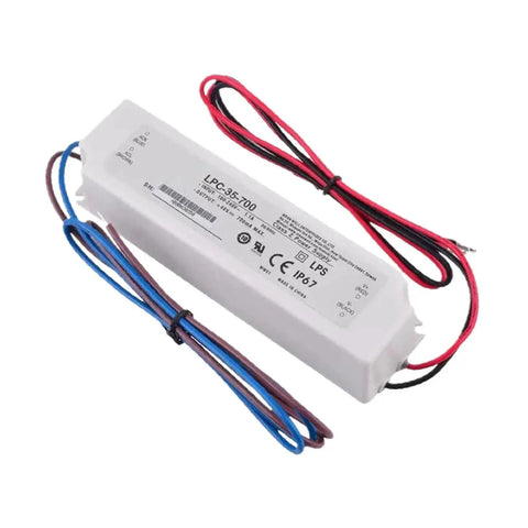 Rugged IP67 Waterproof LED Driver With 700 mA Constant Current For Outdoor Industrial Signage And Architectural Lighting Fully Sealed Enclosure Built To Weather Rain Dust And High Pressure Washdowns, white sealed 148x40x30 mm driver with wires