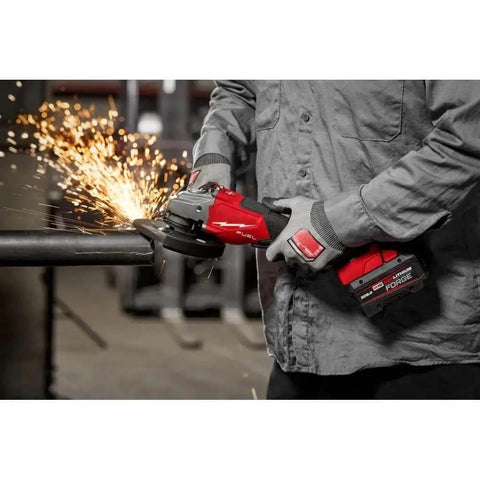 Gnarly Heavy Duty Cordless Angle Grinder Compatible With M18 Tools Offering 4 1 2 Inch 6 Inch Cutting Grinding Capability Brushless Motor pumps out sparks while cutting steel.