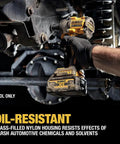 Person using Atomic 20V Max 1/2 Inch Cordless Impact Wrench with Hog Ring Anvil Tool on vehicle axle