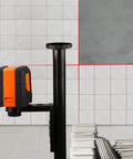 50 Feet Self Leveling Laser Level With Horizontal And Vertical Cross Line Quick Pendulum Leveling System projecting on tiled wall