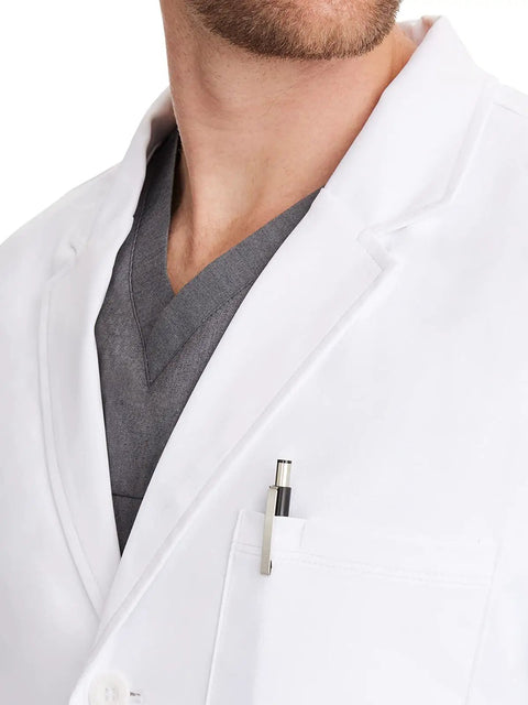 Close-up of short white lab coat with five pockets soft two way stretch fabric all day comfort for nurses clinicians and medical pros