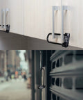 Set Of Six Six Inch Long Shackle Combination Padlocks With Resettable Four Digit Codes, locked on cabinets and gate.