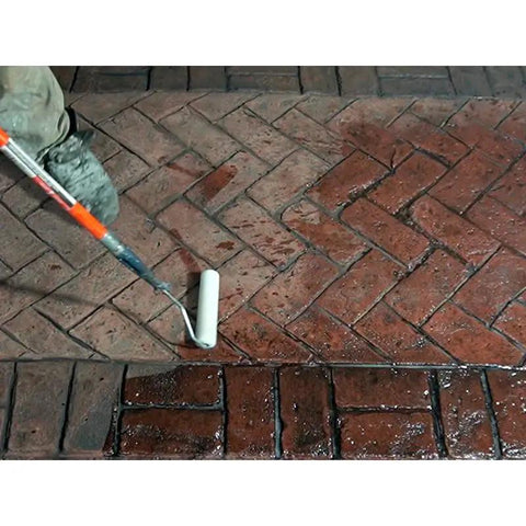 Heavy Duty Solvent Based Acrylic Concrete Sealer Boasting Rock Solid High Gloss Finish being applied with a roller on stamped patio.