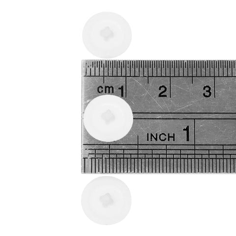 Close-up of three 200 Pieces White Plastic Self Tapping Screw Cap Covers 7mm Diameter with ruler for size reference.