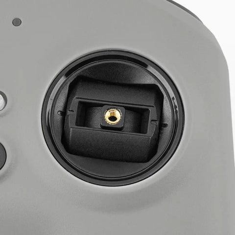 Close-up of T8L ExpressLRS 2.4GHz Hall Gimbal Compact Radio Transmitter bind button for RC Drones Mode 2 with ELRS module.