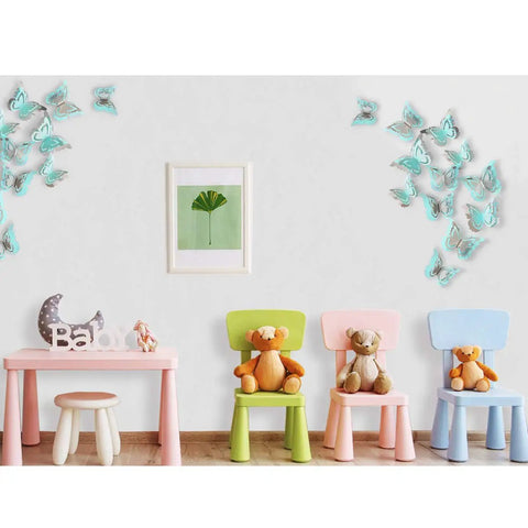 Silver Blue Teal Butterfly Wall Decals Set 27 Pieces 3D Glitter Butterflies Wall Art in nursery with pastel chairs