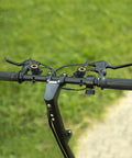 Handlebars with pair of variable speed bicycle shifters shift levers in black and silver tone for smooth gear changes.