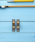 Heavy Duty Stainless Steel Sliding Door Wheels Featuring Double Bearing Pulleys on a blue background with measuring tools.