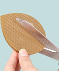 Polyurethane Shoe Heel Repair Pads Half Round Sole Protectors For Sneakers and Athletic Kicks cut with scissors for custom sizing.