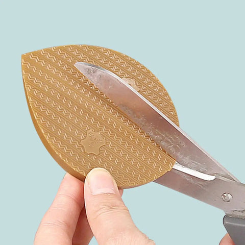 Polyurethane Shoe Heel Repair Pads Half Round Sole Protectors For Sneakers and Athletic Kicks cut with scissors for custom sizing.