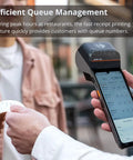 Plug And Chug Android 13 Handheld POS System With Integrated 58mm Thermal Printer cranks out receipts for efficient queue management.