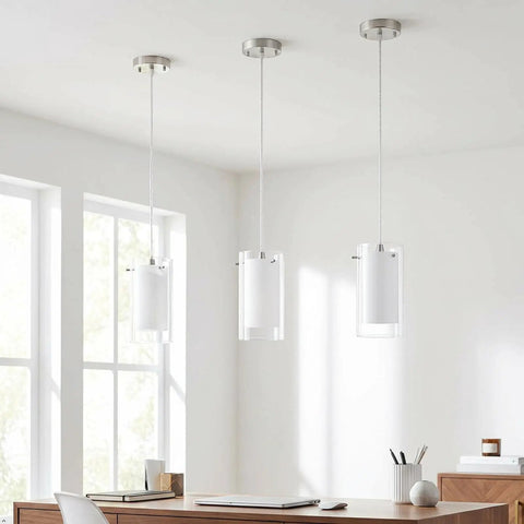 One Light Pendant Light With Clear And Frosted Glass Shade, adjustable height, modern brushed nickel finish in a dining room
