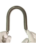 Heavy Duty Stainless Steel Extension Spring Featuring Beefy Gauge Wire for Garage Builds and Home Repairs, held with gloves.