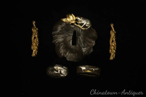 Brass Gold And Silver Plated Katana Fittings Set Tsuba Guard Menuki Fuchi Kashira on black background