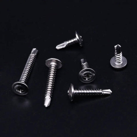 410 Stainless Steel Self Drilling Screws Kit For Metal With Wafer Head Phillips Drive Six Size Assortment scattered on black background