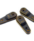 Three Beefy Aluminum 25T Servo Horn Steering Arm Upgrades for One Tenth Scale Crawlers with 25T Spline and M3 Threads in black gold.