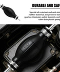 Slick Heavy Duty Rubber Fuel Transfer Pump Bulb on engine, black rubber with silver fittings for safe gasoline and diesel use.
