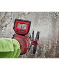Solid 12 Inch Digital Measuring Wheel With Bright IP54 Backlit Display and Smooth Telescoping Handle for Quick Job Site Layouts in use outdoors.