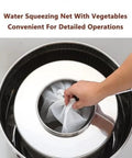 Water squeezing net with vegetables in stainless steel container for detailed operations, enhancing food preparation.