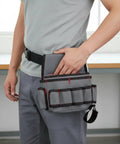 Rig Ready Waterproof Oxford Canvas Tool Belt Waist Pack With Slick Adjustable Strap And Killer Storage Loops Hella Comfortable For Electricians Crushing It On Site, worn by user, showcasing side storage compartments.