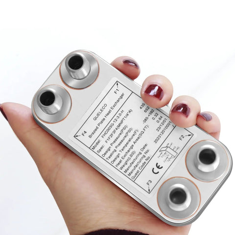 Person holding Custom Plate Heat Exchanger 2x5 Inches, 12 Plate Water To Water System with One Quarter Inch NPT Fittings