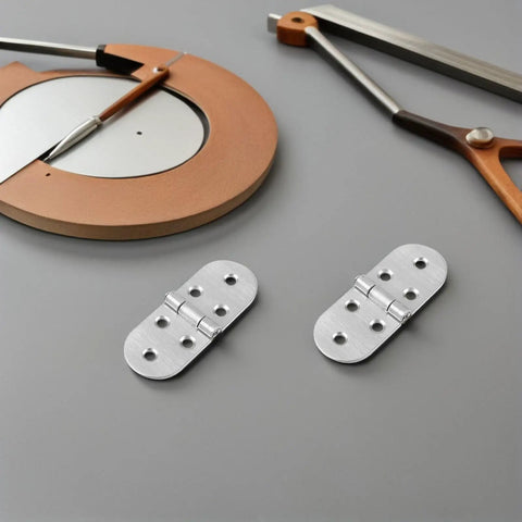 Stainless Steel Desk Hinges Flip Top 4 Pack With Round Edges, placed on a gray surface beside a compass and a saw.