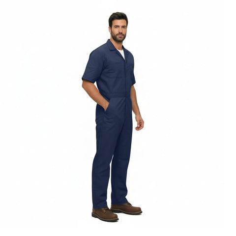 Essential Men's Short Sleeve Zip Up Coverall in Navy Blue worn by man, made from durable poly cotton blend for heavy duty tasks.