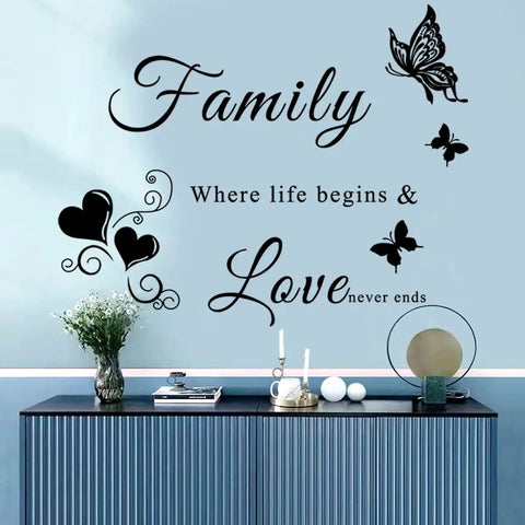Inspirational Family Wall Decal Set With Vase Blue Flower And Hearts Vinyl Lettering Quote For Living Room Bedroom And Dining Room Decor Easy DIY Wall Art For A Warm Cozy Vibe Home displayed on a blue wall above a console